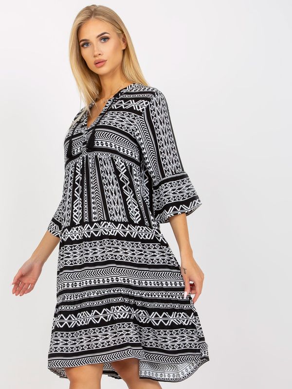Fashionhunters Black patterned dress with ruffle and 3/4 sleeves