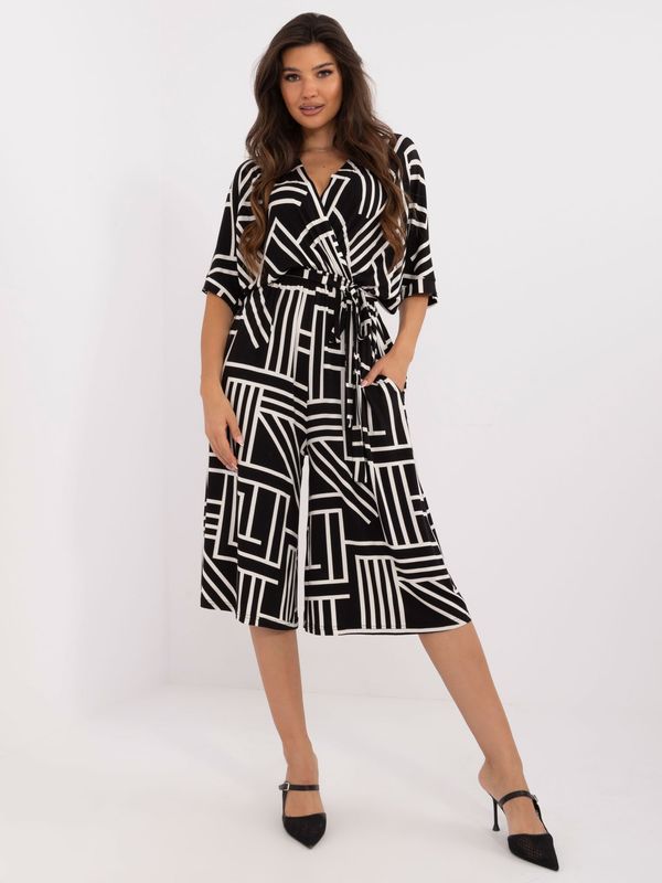 Fashionhunters Black patterned jumpsuit with tie on the back