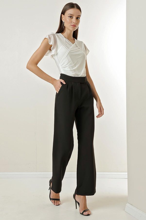By Saygı By Saygı A snap fastener at the waist, Pockets and Wide Leg Trousers.