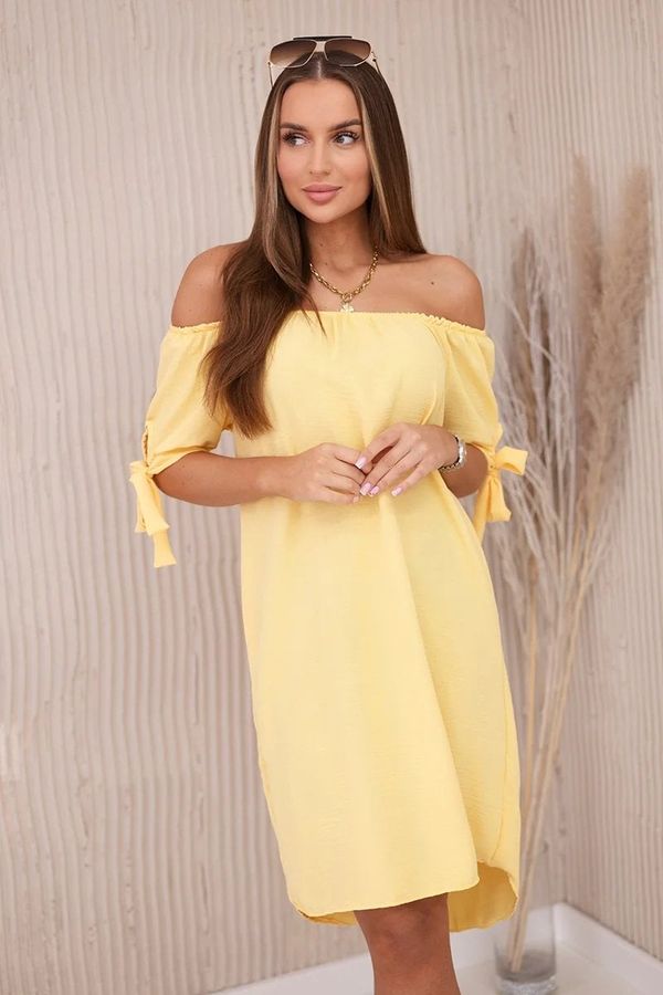Kesi Dress with a longer back and ties on the sleeves yellow