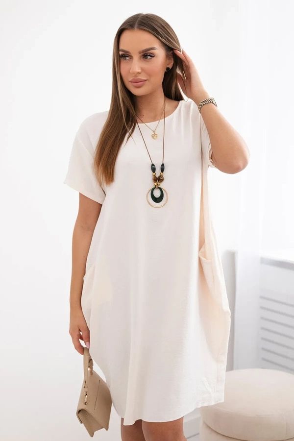 Kesi Dress with pockets and pendant light beige