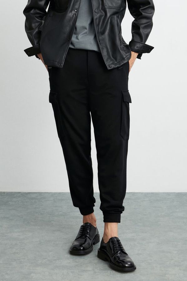 GRIMELANGE GRIMELANGE Leroy Men's Thick Textured Fabric 6 Pocket Wide Cut Elastic Waist Black Trousers with Velcro Legs