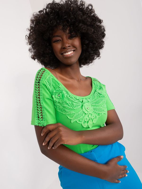 Fashionhunters Light green blouse with lace and appliqué