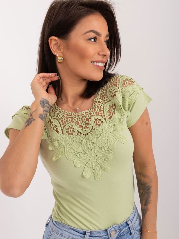 Fashionhunters Pistachio women's blouse with lace on the back