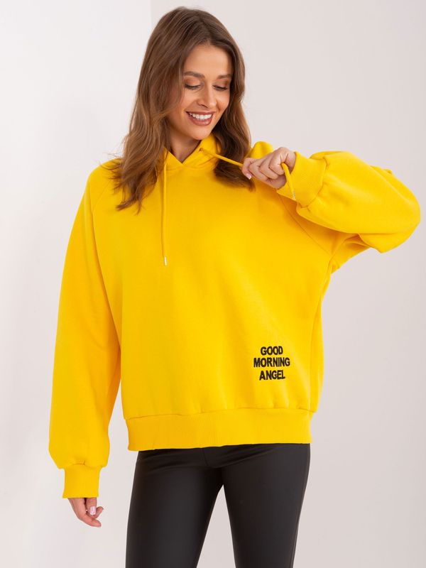 Fashionhunters Yellow insulated oversize sweatshirt with a hood and inscription