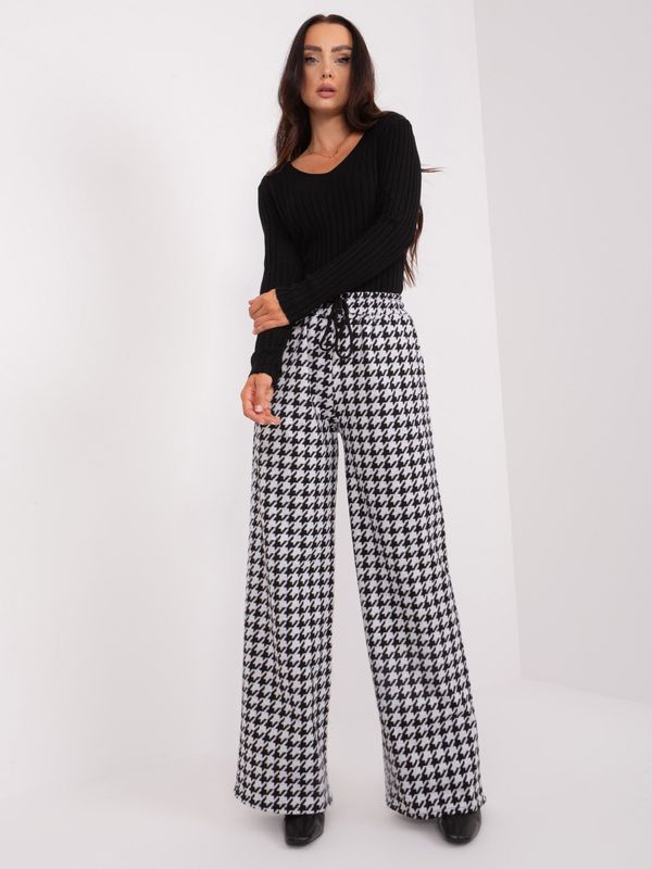 Fashionhunters Black and white patterned fabric trousers