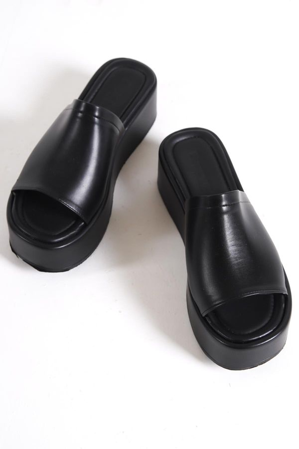 Capone Outfitters Capone Outfitters Capone Sole Womens Black Wedge Heels with a thick strap and heel.