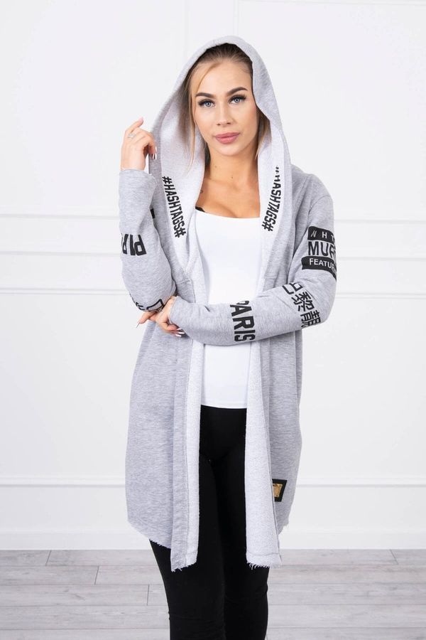 Kesi Coat with light gray subtitles