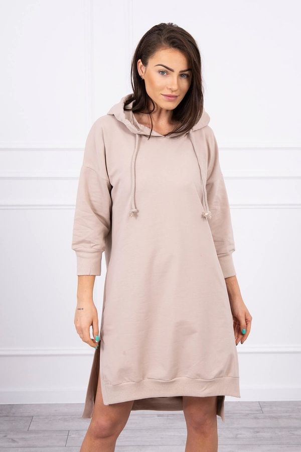 Kesi Dress with a hood and a longer back in beige color