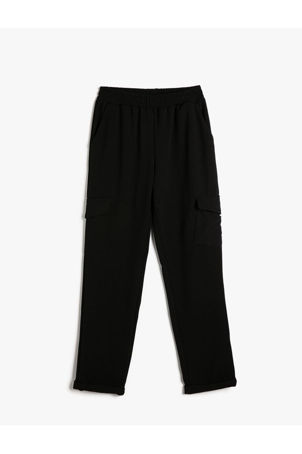 Koton Koton Cargo Trousers have an elasticated waist, pocket detail, and fold over legs.