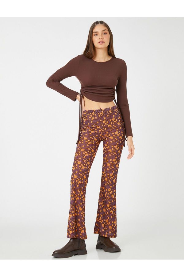 Koton Koton Flared Floral Trousers with an Elastic Waist.