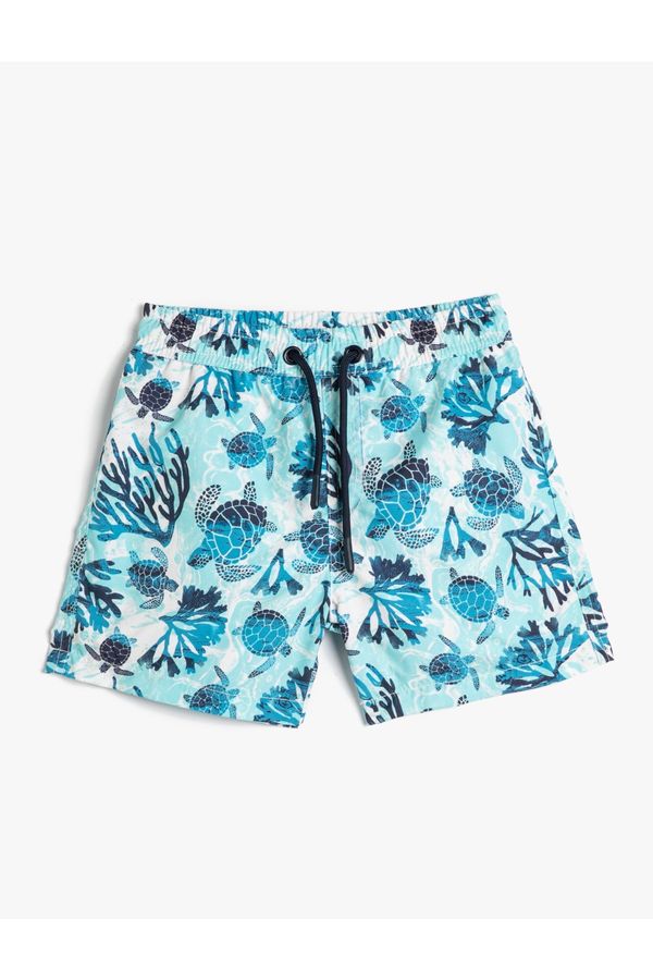 Koton Koton Marine Shorts with a Tie Waist Turtle Printed Mesh Lined.