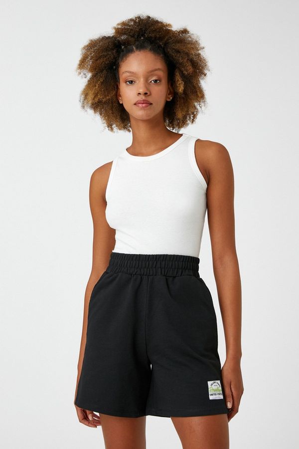 Koton Koton Mini Shorts with a thick elasticated waist. Pockets Tag Detail.