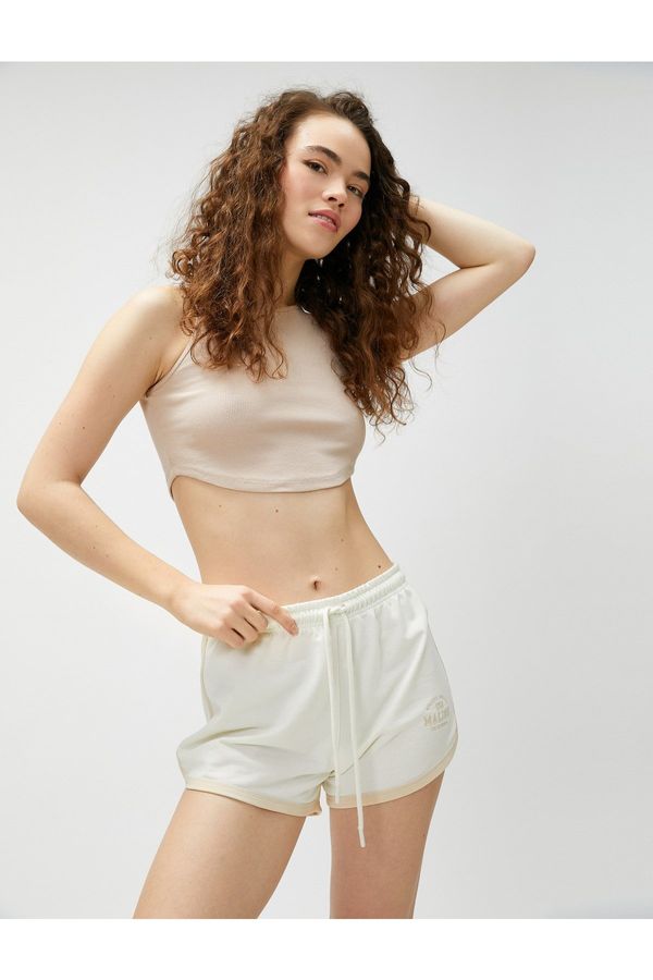 Koton Koton Mini Shorts with Lace-Up Waist and Embroidered Pile Detail.
