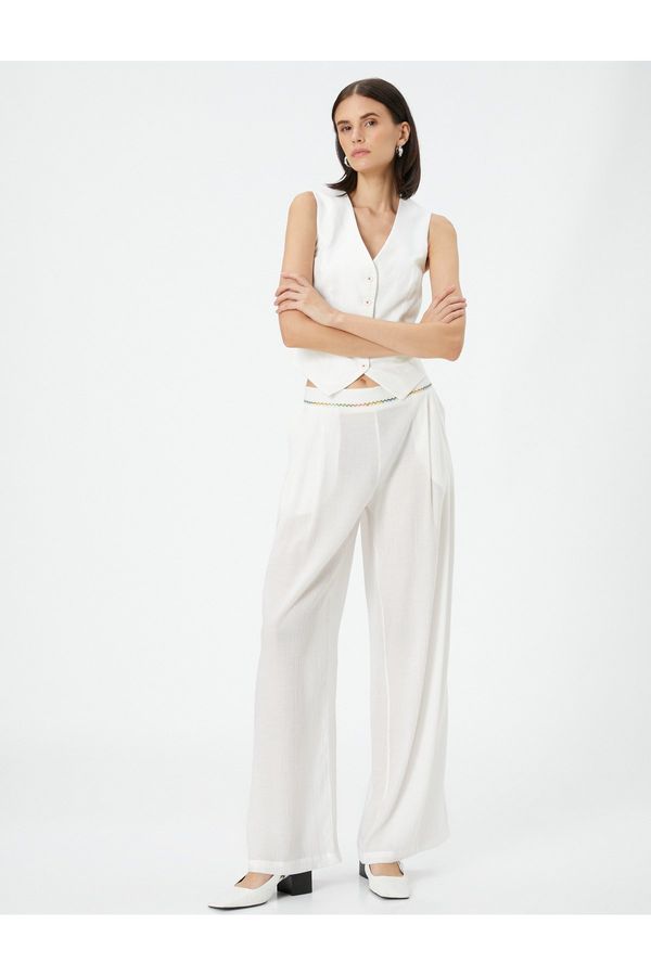 Koton Koton Palazzo Trousers Loose Fit, Normal Waist, Pockets with Embroidery Detail.