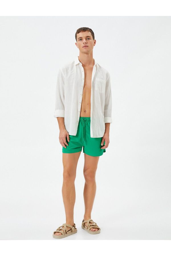 Koton Koton Swimsuit Shorts Short waist with a tie-down pocket.