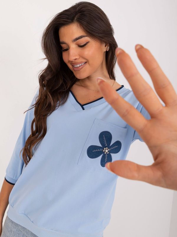 Fashionhunters Light blue cotton blouse with floral motif