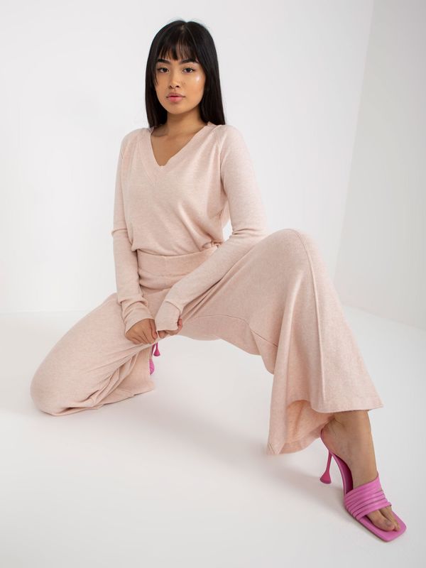 Fashionhunters Light pink knitted trousers with wide legs