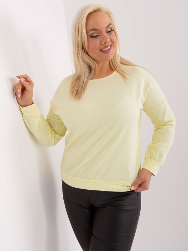 Fashionhunters Light yellow plus size blouse with a round neckline