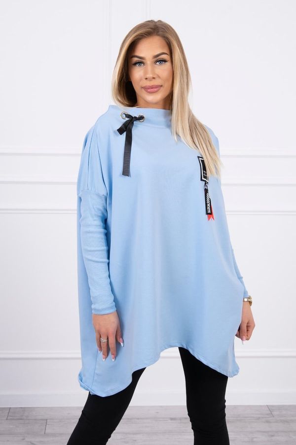 Kesi Oversized sweatshirt with asymmetrical sides in cyan color