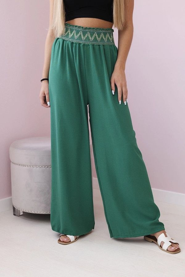 Kesi Trousers with a wide elastic waistband in green colour